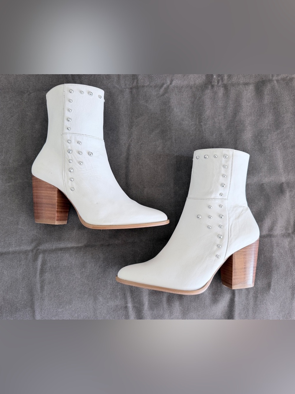 Women’s White leather ankle boots with studs. Size 9.